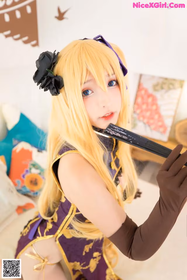 A woman in a purple and gold outfit holding a sword.