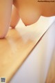 A close up of a person's foot on a wooden table.